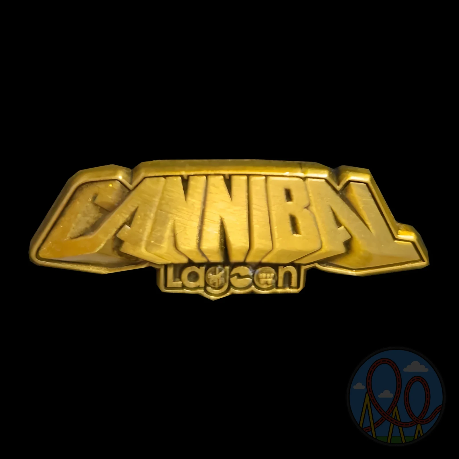 Golden Cannibal amusement park pin